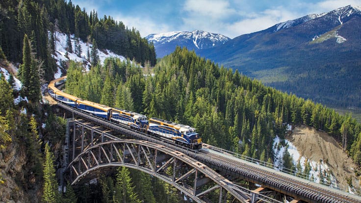 Journey on the Rocky Mountaineer  through the rugged terrain of the Canadian Rockies with a pre or post cruise land program to the Great Land.