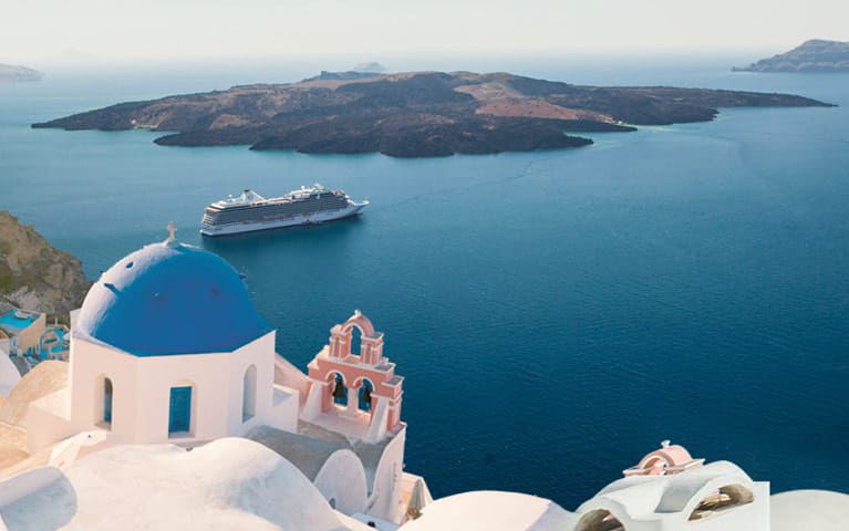 An Oceania cruise ship departs from Mykonos destination port into open sea water.