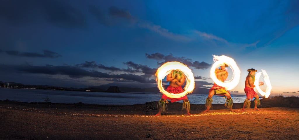 Cruises to South Pacific, fire spinning on beach