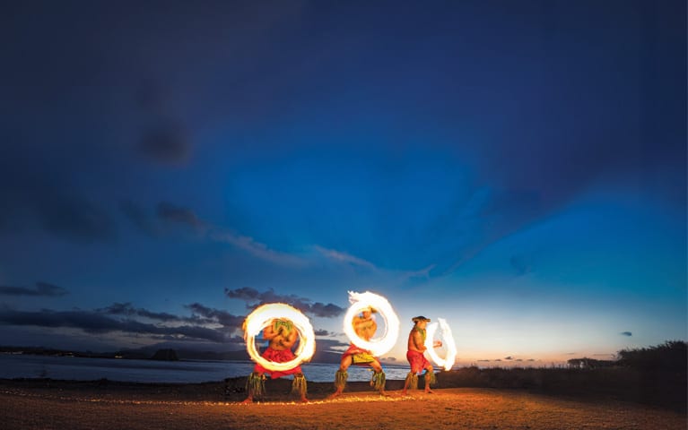 Cruises to South Pacific, fire spinning on beach