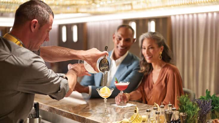 Couple enjoying cocktails at Founders Bar onboard Oceania Cruises