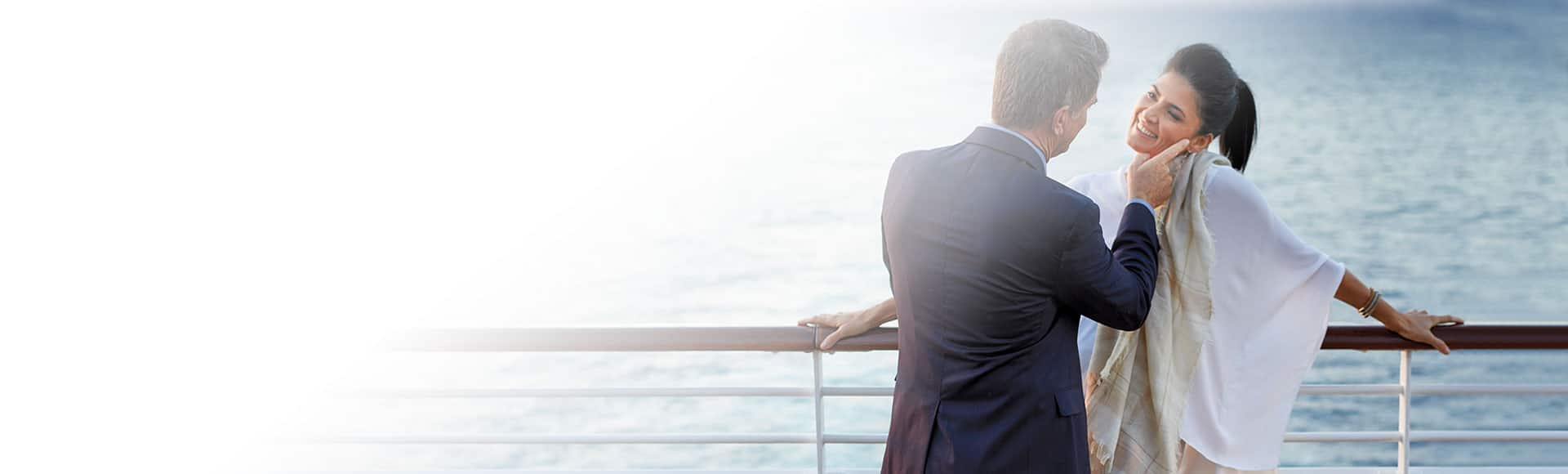 Couple enjoying sunset on terrace on board Sirena