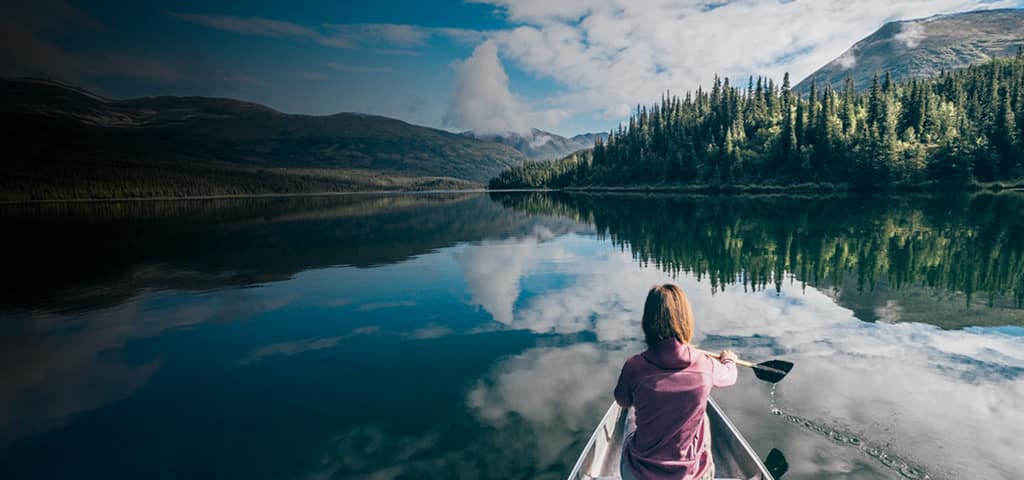 Cruises to Alaska, woman in kayak in national park