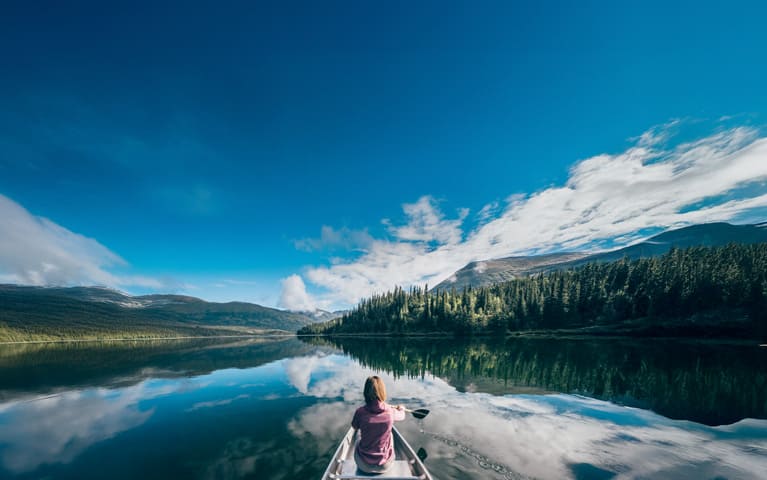 Cruises to Alaska, woman kayaking in a national park
