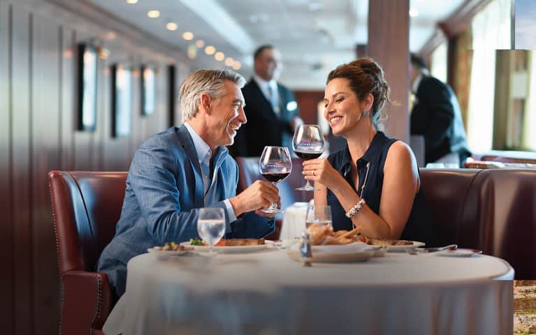 Your World Included, couple having dinner and wine at a free specialty dining restaurant