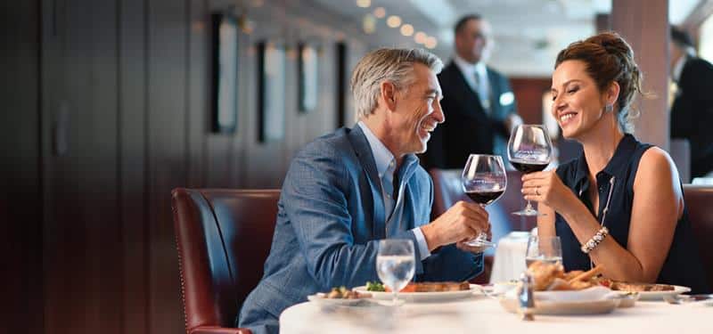 Your World Included, couple having dinner and wine at a free specialty dining restaurant